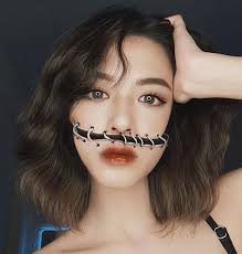 vietnamese makeup artist uses her face