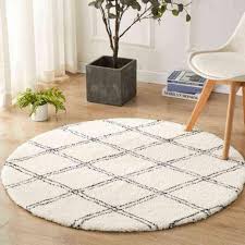 white geometric round carpet