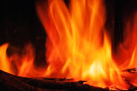 A Close Up Of A Fire In A Fireplace