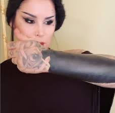 blacked out arm tattoo