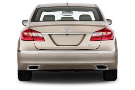 The vehicle is red with a tan interior. Hyundai Genesis 2012 International Price Overview