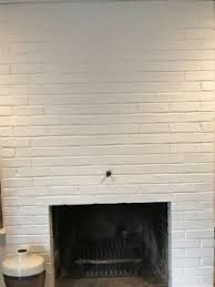 Heavy Mirror On A Brick Fireplace Wall