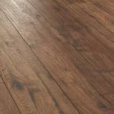 Plus, laminate flooring is affordable. Laminate Wood Flooring Distressed Brown Hickory 12 Mm X 6 26 In X 50 78 In 30 73 Home Depot Flooring Wood Floors Wide Plank House Flooring