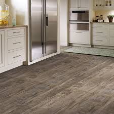 One of the biggest new trends in home décor over the past few years is the rise of porcelain and ceramic tile that looks like wood. Black Mountain Lvs A Modern Rustic Look That Combines A Fine Sawn Finishing Technique W Natural Distressing Vinyl Flooring House Flooring Luxury Vinyl Tile