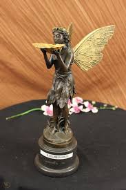 large bronze metal garden fairy statue