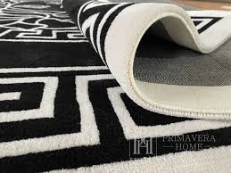 a modern black and white rug meduza