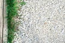 How do you treat weeds in a gravel driveway?