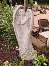 concrete angel statue casey and gram