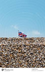 union jack flag flying above a pebble