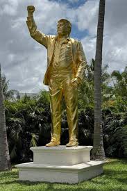 A nearly seven-meter-tall gold statue of Donald Trump is now standing at his Doral golf resort in Miami. It shows him with his fist raised, modeled after the 2024 "assassination attempt" photo.
