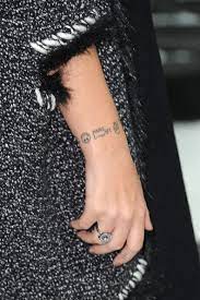 Lily has got an inking of the world on her wrist. Lily Allen Band Tattoo Band Tattoo Lily Allen Celebrity Tattoos