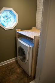 Stackable washer and dryer sets are an easy solution. Diy Stacked Washer And Dryer Laundry Room Storage Small Laundry Room Organization Laundry Room Storage Shelves