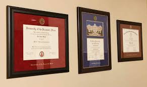 Multiple Diplomas On A Wall