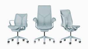 The soft, plush frame features a button tufted back and is upholstered in a light blue Cosm Office Chairs Herman Miller