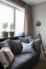 dark grey sofa with ter cushions
