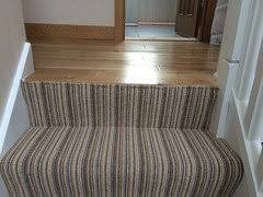 carpet stairs to wood landing