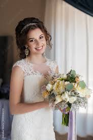 tiara holding a wedding bouquet