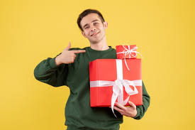 See more ideas about gifts for young men, men, bluetooth earbuds wireless. Front View Young Man With Xmas Gift Pointing At Xmas Gifts Standing On Yellow Background Free Picture On Freepik