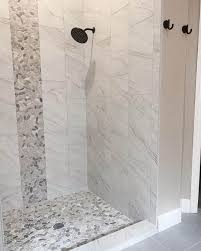 stone shower floor and large light grey