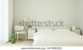 Place your accessories and storage boxes between the beds and leave the rest of the room free. Shutterstock Puzzlepix