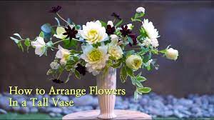 The flower heads should protrude about an inch past the edge of the vase. How To Arrange Flowers In A Tall Vase Youtube