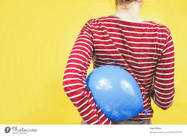 back view of a holding a balloon