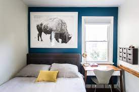 kids bedroom with a blue accent wall