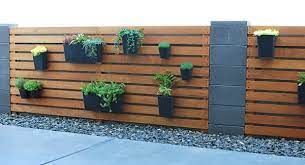 diy wood slat garden wall with planters