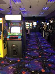 arcade machines in a room with