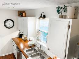 how to decorate above kitchen cabinets