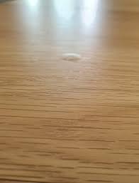 bubbles in a wooden tabletop ommik