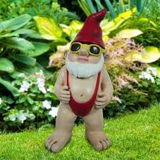 Female garden gnome with a red hat and teal coat with gold belt by some lily pad statues. Angelo Decor International Mankini Gnome Statue Lowe S Canada
