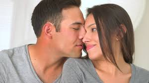 cute mexican couple kissing stock