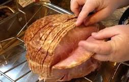 How do you heat up a spiral ham without drying it out?