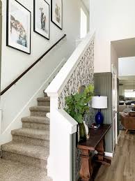 Hallway becomes the inevitable part of design ideas and picturesrhunickorcom iron railing designs railings for modern stairs with dark rhpinterestcom iron hanging pictures on stairs. How To Hang Photos On Your Staircase Love Renovations
