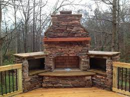 outdoor fireplace on wood deck with