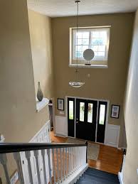 how to decorate a two story foyer with