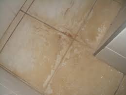 clean stained tiles with stubborn dirt