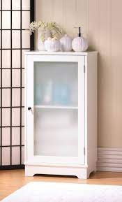 white storage cabinet with glass doors