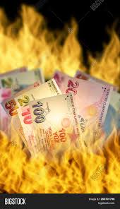 To keep bacon slices straight and reduce shrinkage, weigh them down with an iron bacon press during cooking. Turkish Lira Banknotes On Fire Concept Image Stock Photo 260701798