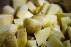 What should I do if I ate undercooked potatoes?