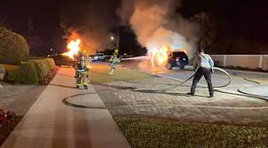 firefighters extinguish car blaze after