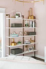 White And Gold Shelving Unit On Dark