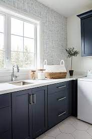 dark blue laundry room cabinets with