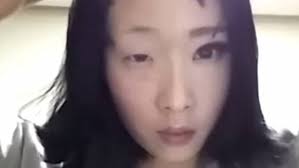 south korean woman removes makeup