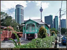 Kampung baru is a traditional village in kuala lumpur city centre, where you can enjoy a day of strolling around wooden stilt homes and coconut and banana trees, against a backdrop of the city's modern skyscrapers. Kampung Baru A Photo From Kuala Lumpur West Trekearth
