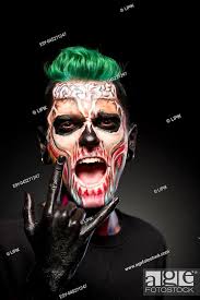 man with halloween makeup showing