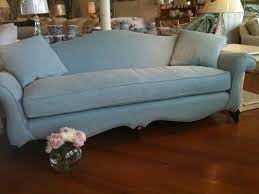 camelback sofa slipcovered