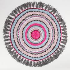 a small rug woven on a circular loom