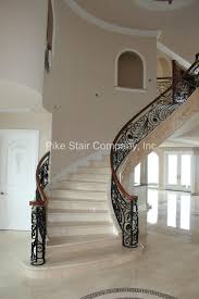 marble staircase with maple handrail